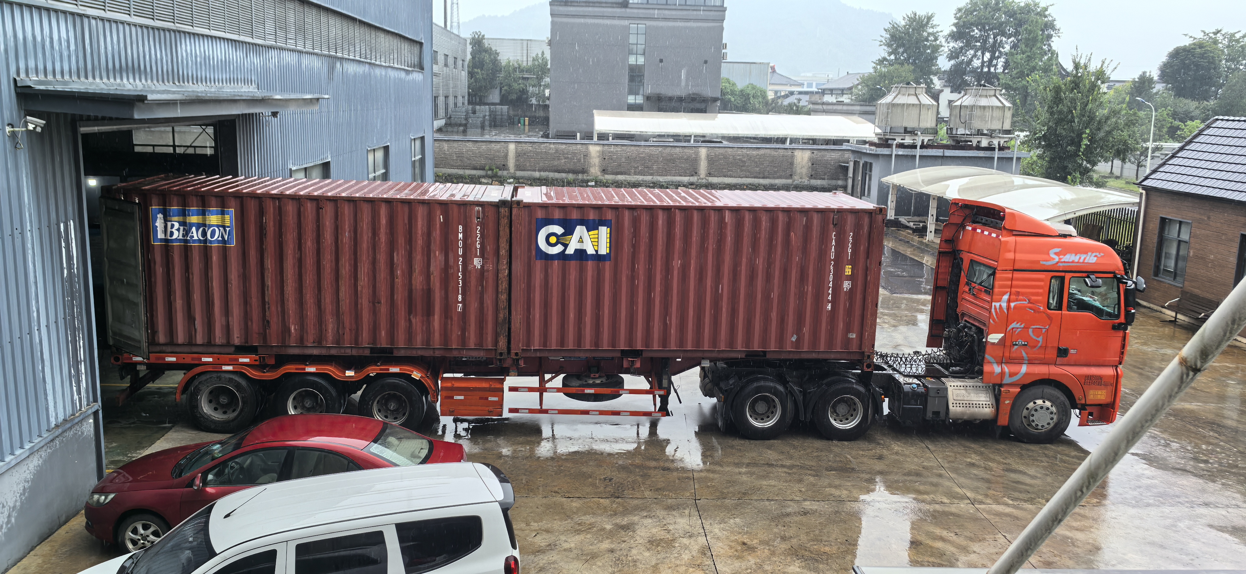 Horse stable panels being loaded into containers for export